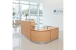 Flow Reception Desk in a 2400x1600 Beech finish, positioned in a busy office reception area