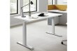 Boost Light sit stand desk in 1200x750 White finish, height-adjustable, set up in a modern office environment.